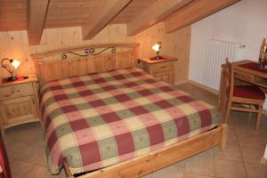 Posteľ alebo postele v izbe v ubytovaní Chalet Alberti