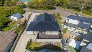 an overhead view of a house with blue roofs at Suthar's Home in Wellington