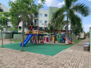a playground with a slide in a park at Apartamento vita bella in Porto Velho