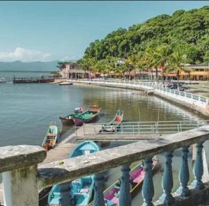 a group of boats are docked in the water at Studio Funcional in Guaraqueçaba