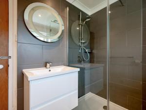 a bathroom with a sink and a mirror at 4 Bed in Cromer oc-81469 in West Runton +31 photos