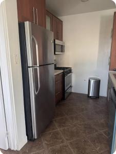 a kitchen with a stainless steel refrigerator at The Palms apt 1 in Cedar Grove