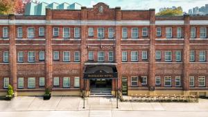 a large brick building with a sign that reads museum vault at MarQueen Hotel - NEWLY RENOVATED in Seattle