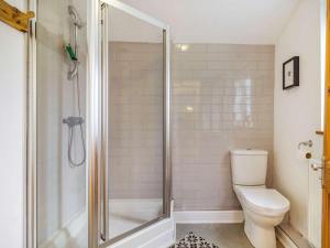 a bathroom with a shower and a toilet at 4 Bed in Holt oc-87148 in Holt +12 photos