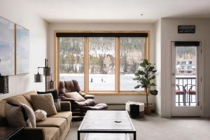 a living room with a couch and a table and a window at Lakefront Keystone Escape - Near Slopes & Trails in Keystone
