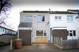 a large brick house with a wooden gate at 6 Bed home near to Birmingham Nec Airport 6 miles from city centre in Marston Green