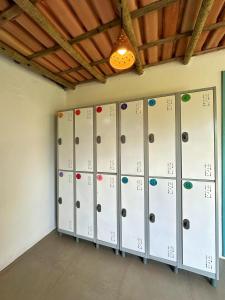 a row of lockers in a room with a light at OCA Caraíva in Caraíva
