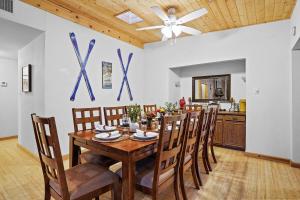 a dining room with a wooden table and chairs at Airy Alto Escape Deck Games Views in Sun Valley