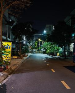 an empty street in a city at night at Long homestay A5-57 in Ðức Hòa
