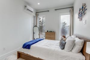 a bedroom with a large bed and a window at Mtn-View 'Hidden Falls' Cabin w/ Hot Tub & Deck in Andrews