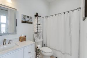 a white bathroom with a toilet and a shower at Mtn-View 'Hidden Falls' Cabin w/ Hot Tub & Deck in Andrews +29 photos