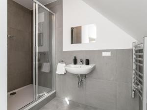 a bathroom with a sink and a shower at NRV Top 7 in Möderbrugg +35 photos