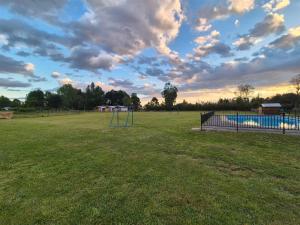 a park with a playground with a basketball hoop at Cabañas y tinajas Filkun in Vilcún