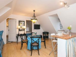 a kitchen and dining room with a table and chairs at 4 star holiday home in Skanderborg in Skanderborg