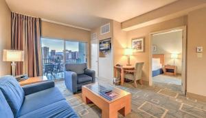 a living room with a couch and a room with a bed at The Platinum Hotel Las Vegas in Las Vegas +40 photos