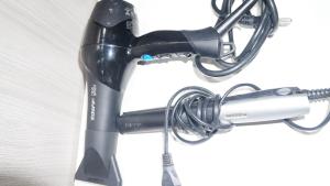 a hair dryer is attached to a wire at Casa compartilhada com Quarto e Suite no Parque 10 in Manaus
