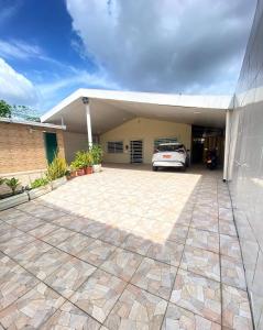 a car parked in the garage of a house at Casa compartilhada com Quarto e Suite no Parque 10 in Manaus