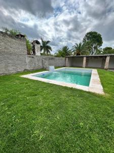a swimming pool in the yard of a house at Kusi 51 in La Banda