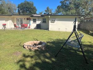 a fire pit in a yard in front of a house at Horizon Haven in Jacksonville