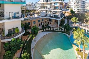 an aerial view of an apartment complex with a swimming pool at Waterfront Seaview Residence in Villajoyosa