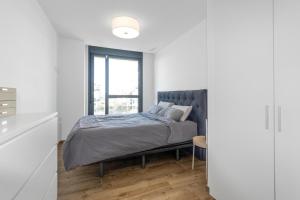 a bedroom with a bed and a window at Waterfront Seaview Residence in Villajoyosa +15 photos