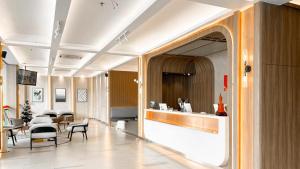 TV a/nebo společenská místnost v ubytování Batam City Hotel