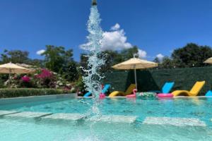 a fountain in the middle of a swimming pool at Hotel P INC General Santos in General Santos