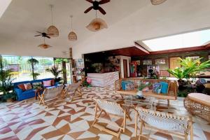a large living room with chairs and a couch at Hotel P INC General Santos in General Santos