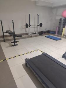 a room with a gym with a bed and weights at Valparaiso01 in Valparaíso