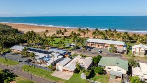an aerial view of a resort and the beach at Sarina Beach Motel in Sarina