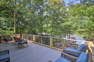 a deck with chairs and a view of a river at Dockside Lakefront Escape Deck Views in Jacksons Gap