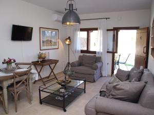 A television and/or entertainment centre at Melograno Apartments and Studios