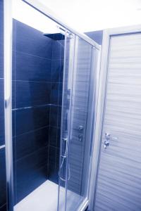 a shower with a glass door in a bathroom at B&B Homedesign in Salerno