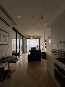 a large living room with a couch and a table at CARTER Flat in Ho Chi Minh City