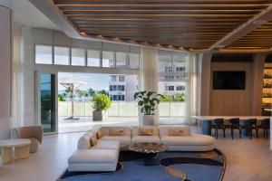 a living room with a couch and a table at W Fort Lauderdale in Fort Lauderdale