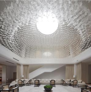a large lobby with a large ceiling with a glass ceiling at GUILIN LI RIVER CIAO Hotel in Guilin