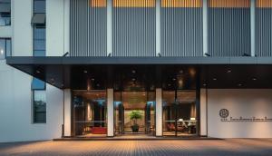 an external view of a building at GUILIN LI RIVER CIAO Hotel in Guilin +82 photos