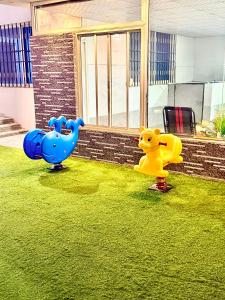 two childrens play equipment in the yard of a house at شاليهات حياة روز in Taif