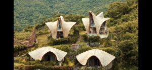 a group of houses on top of a hill at Villa Cecilia Luxury with Sea view Pool - ANIMA Eco Lodge in Selong Belanak