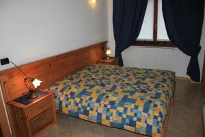 Posteľ alebo postele v izbe v ubytovaní Chalet Alberti