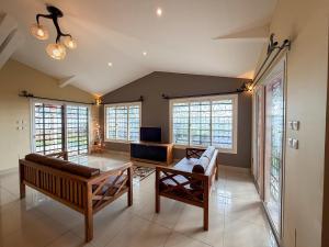a living room with a couch and a table at Diego Bay Villa in Antsiranana