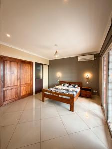 a bedroom with a bed in a room at Diego Bay Villa in Antsiranana