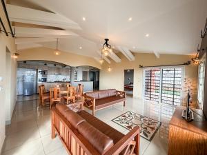 a living room with a couch and a table at Diego Bay Villa in Antsiranana