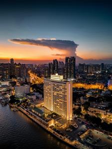 a view of a city with a large building at Skyline Grand International Hotel - Prime Tianhe City Center Walkable Subway Top Pick for Canton Fair Stunning High Floor Panoramic City View Luxury Guest Rooms in Guangzhou
