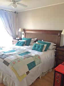 Postel nebo postele na pokoji v ubytování Apartamentos Terrazas de Talca