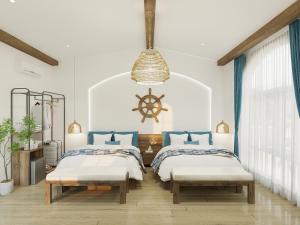 a bedroom with two twin beds and a nauticalventoryventoryventoryventory at Hotel SHOL Ninh Chu in Thôn Nhơn Sơn