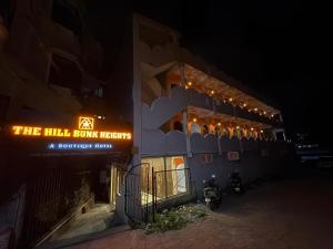 a building with a sign that reads the hill burn heeth at The Hill Bunk Heights Ooty in Ooty