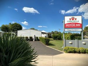 a sign for a motor inn in front of a house at Chinchilla Motor Inn in Chinchilla +45 photos