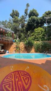 a swimming pool with a painting on the ground at Catba Chilling House Pool & Bar in Cat Ba