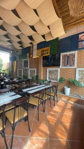 a row of tables and chairs in a restaurant at Catba Chilling House Pool & Bar in Cat Ba